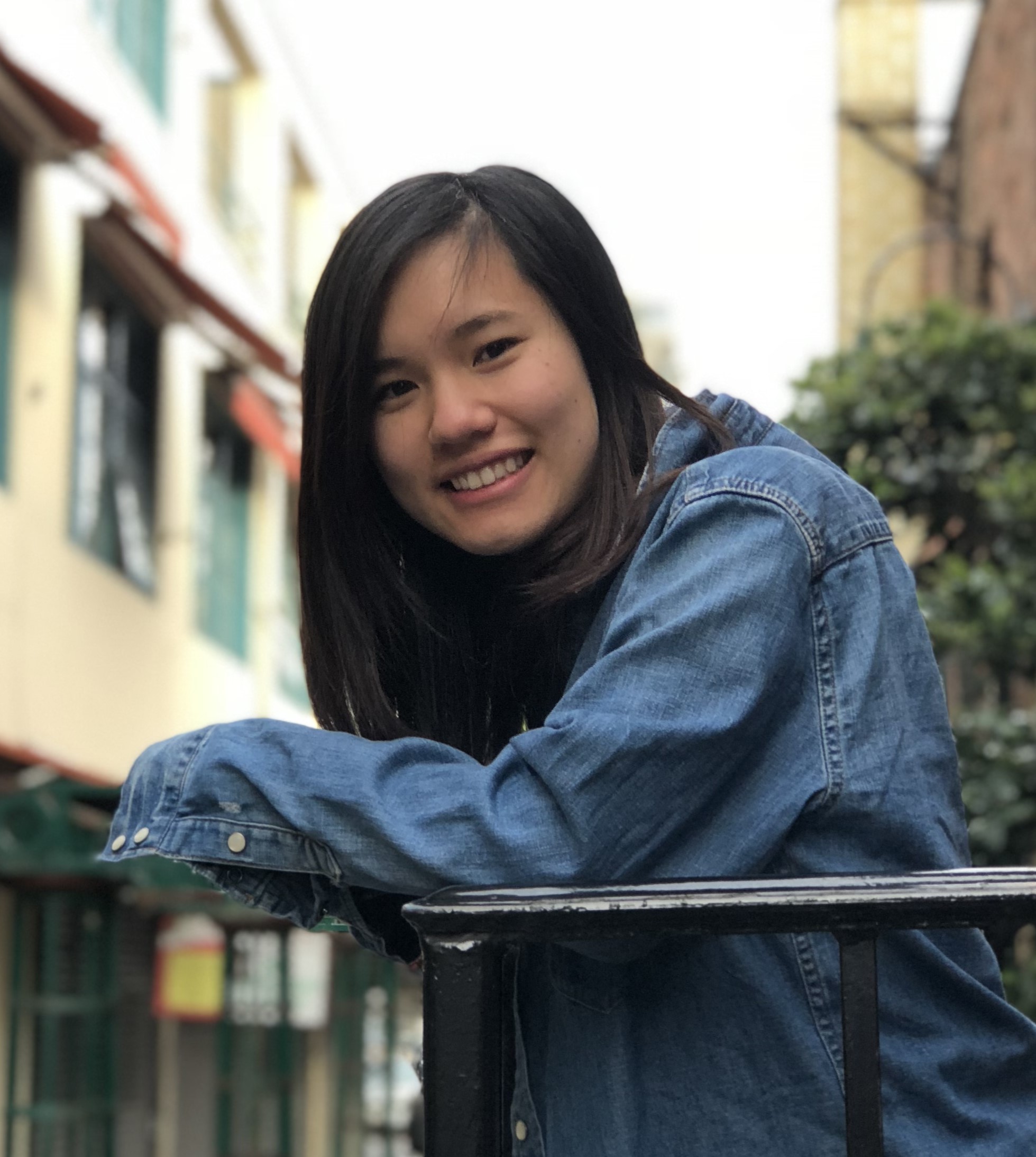 A picture of Jessamyn smiling over a railing.